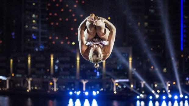 Rhiannan Iffland of Australia dives from the 20.5-metre platform on the Dubai Marina Pier 7 building during a training session of the final stop of the Red Bull Cliff Diving World Series.