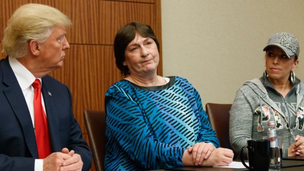 Trump, left, and Paula Jones, right, look on as Kathy Shelton makes remarks.