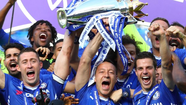 John Terry (centre) lifts the Premier League trophy at Stamford Bridge in May.