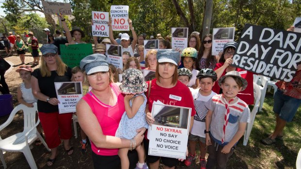 Murrumbeena residents Karlee Browning and Tracey Bigg attend a protest against a proposed elevated railway line. 