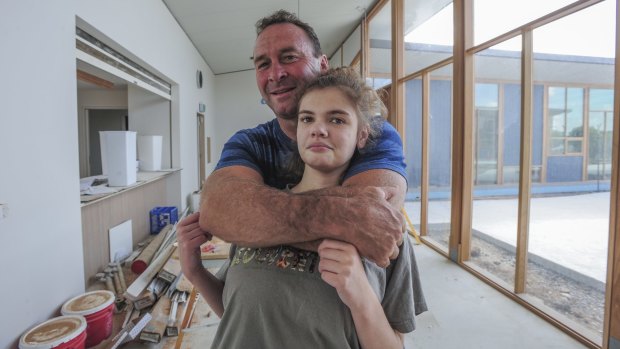 With less than a month to go before the building's opening, Ricky Stuart and his 18-year-old autistic daughter, Emma, visited the Ricky Stuart Foundation respite centre in Chifley.