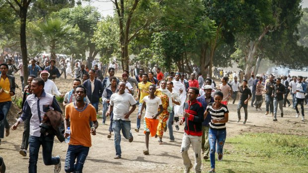 People run during a stampede in Bishoftu, Ethiopia. 