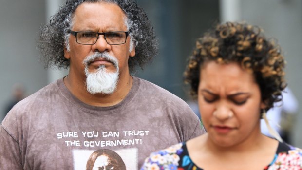 Wangan and Jagalingou traditional owner and council spokesperson Adrian Burragubba and his niece, Murrawah Johnson, speak outside the Brisbane Supreme Court after launching another challenge to the Adani Carmichael mine.