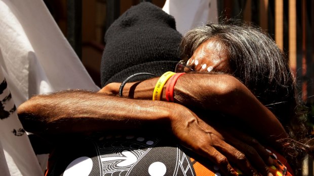 Clinton Speedy-Duroux's aunt, Dolly Jerome (right), is embraced after a march down Macquarie Street in November 2013 asking for a parliamentary inquiry into the deaths.