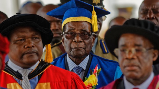Zimbabwe's President Robert Mugabe, centre, made his first public appearance on Friday, since his house arrest.