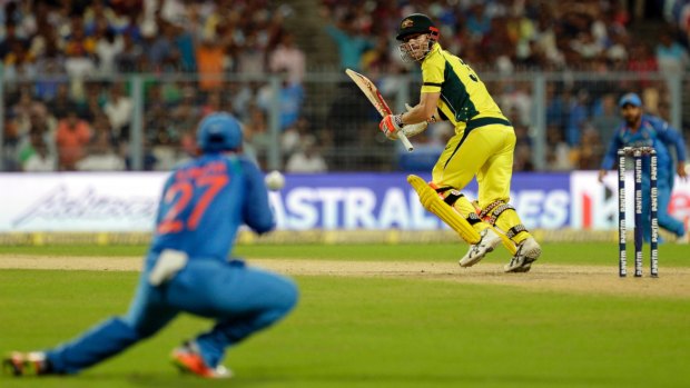 India's Ajinka Rahane takes a catch to dismiss David Warner.