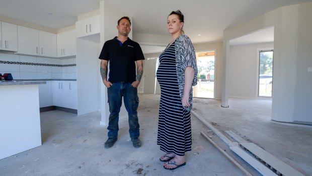 Former Watersun clients Matt Filmer and Ebony Murner in their unfinished house in Meredith. 