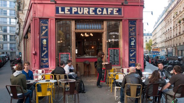 A cafe on a street corner in the Marais district of Paris.