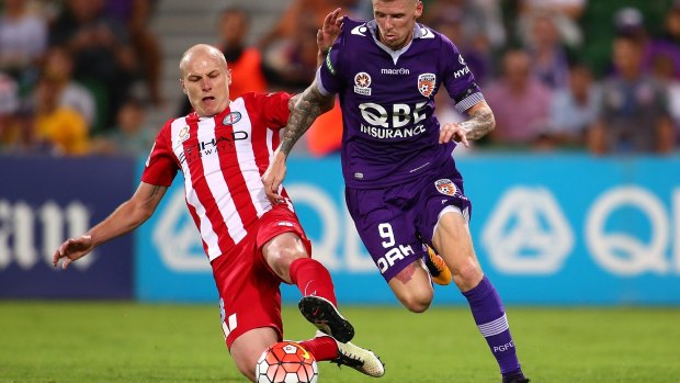 Up to the challenge: Perth's Andy Keogh evades a lunging tackle from City midfielder Aaron Mooy.