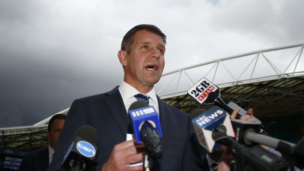 Mike Baird announces the development plan at the ANZ Stadium on Thursday. 