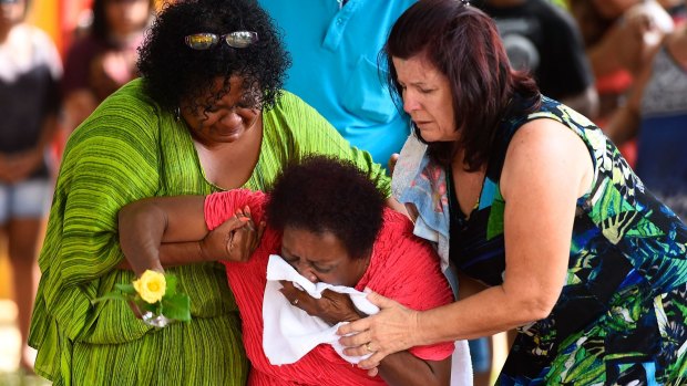 Grief stricken loved ones visit the shrine for the eight children killed in Cairns.