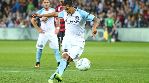 Tim Cahill of City shoots from the spot and scores his first goal.