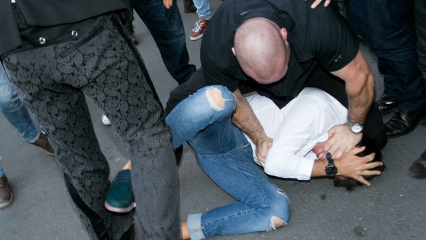 Kardashian West's bodyguard Pascal Duvier tackles Sediuk to the ground.