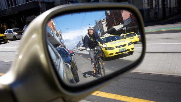 The overlap zone: cyclists often need to merge into faster-moving traffic to pass parked cars.