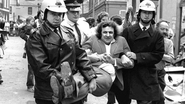 Former BLF boss and green ban man Jack Mundey being carried from a protest at The Rocks in the early seventies.