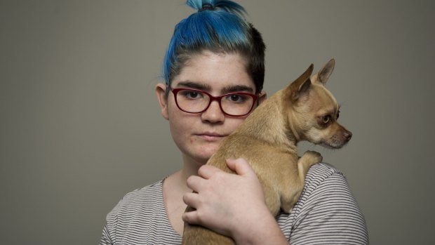 Isabelle Goldstraw with her dog Flea. The two Staffordshire bull terriers killed her other pet Chihuahua in her living room and left her with an injured finger. 
