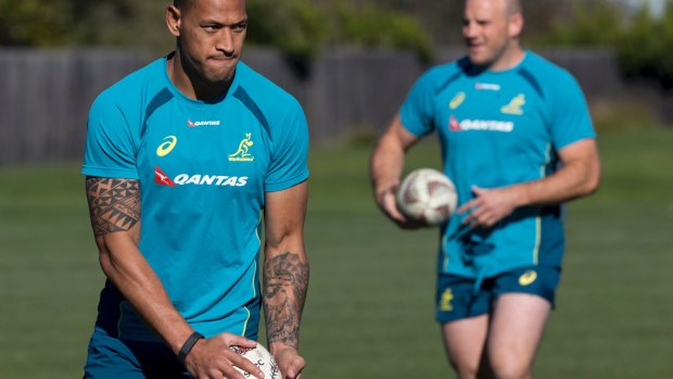 Wallabies fullback Israel Folau prepares to kick a ball during a training session in Christchurch.