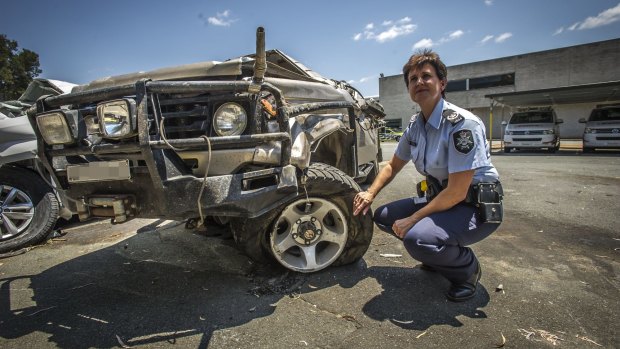 ACT Policing Station Sergeant Susan Ball with a Landcruiser ute involved in a serious single vehicle accident in Canberra suburb of Kenny on Tuesday night.