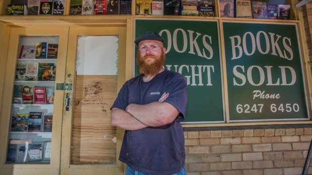 Book Lore bookshop owner Mike Johnson plans to replace a glass door this week smashed by thieves with a solid wooden door - and he would like local artists to paint a book-themed mural across it and the shopfront in a high-profile part of Lyneham.