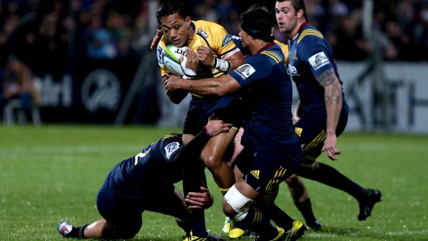 Christian Lealiifano of the Brumbies tries to break through the Highlanders' defence at Rugby Park in Invercargill, New Zealand. 