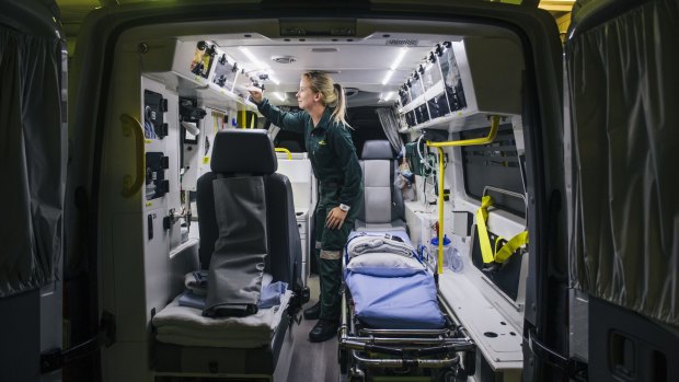Paramedic Jess Wilson restocks the ambulance after a job.