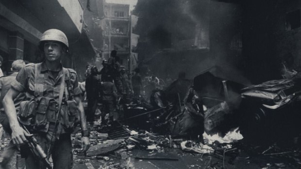 A military policeman at the scene of a car bomb explosion in East Beirut in May 1986.
