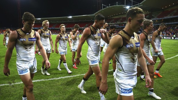  The Hawks look dejected as they leave the ground after the loss to Greater Western Giants, but coach Alastair Clarkson is adamant they are not easy targets.