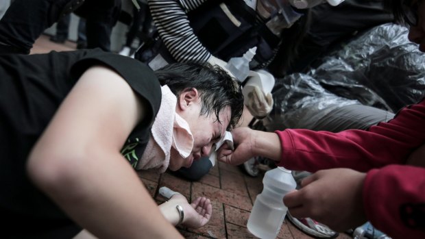 Medical aid: Riot police, armed with pepper spray, batons and water hoses, moved in to disperse the demonstrators.