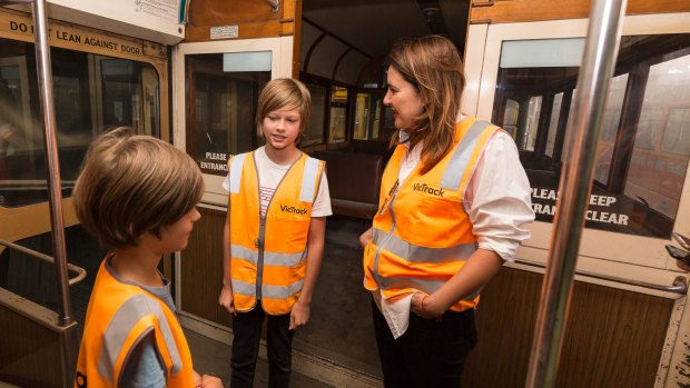 Henry, James and Fiona Larwill on the 722 tram painted by David Larwill.