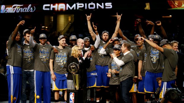 Andrew Bogut, centre, celebrates with his Warriors teammates.