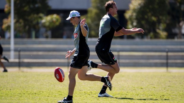 Lachie Keeffe and Josh Thomas back on the track at Collingwood on Monday.