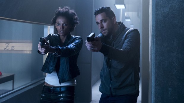 Judith Shekoni (left) as Joanne Collins and Zachary Levi as Luke Collins in <i>Heroes Reborn</i>.