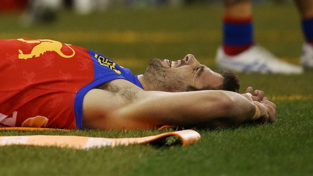 Michael Close on the ground after rupturing his anterior cruciate ligament at Etihad Stadium.