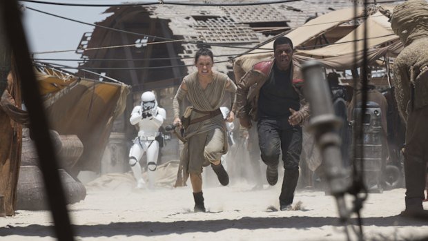 Hasty retreat ... Rey (Daisy Ridley) and Finn (John Boyega) in The Force Awakens.