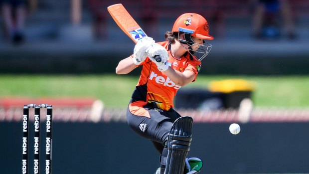 Heather Graham of the Scorchers hits a single during the Women's Big Bash League.