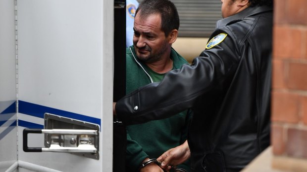 Zlatan Popovic is led to a prison van by Corrective Service Officers at the NSW Supreme Court in Sydney on Friday.