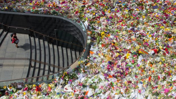 The enormous number of floral tributes in Martin Place suggest this incident has brought home to us a horrible reality.