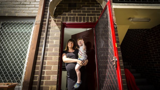 Lucinda Hartley and son Micah outside their tiny Fairfield apartment.