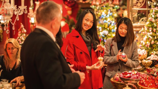 Johann Wanner greets customers in his Weihnachtshaus (Christmas House) in Basel.