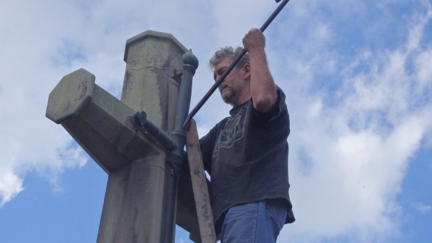 Photos of the Catholic Worker movement members removing the sword from the Cross of Sacrifice on Ash Wednesday. The group pleads not guilty to wilful damage.