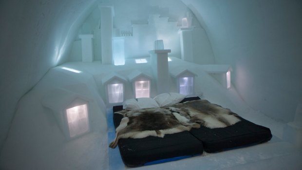 Reindeer hides cover an ice bed in one of the luxury suites at the Icehotel in Sweden.