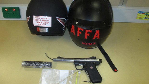 Police say an alleged Hells Angels bikie had a gun and drugs in his car during a traffic stop on the Gold Coast.