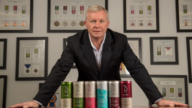 Greg Stokes, chairman and chief executive of Barokes Wines in their Tullamarine offices and warehouse. Some of Barokes Wines many medals are on the wall.