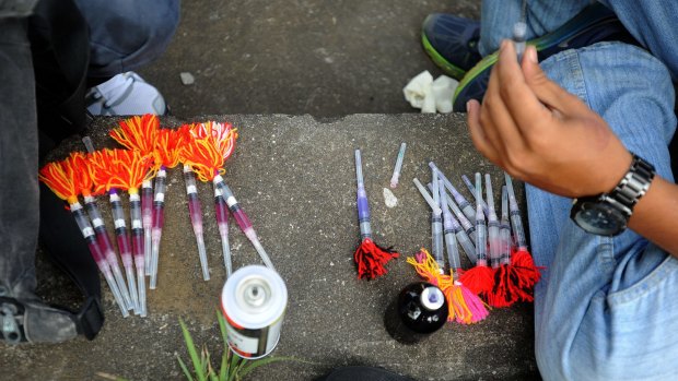 Strychnine-laced darts being prepared for the dog elimination. 