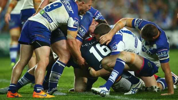 Key moment: Kane Evans scores a controversial try against the Bulldogs on Friday night.