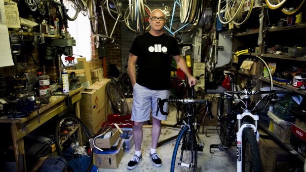 Neil Buttriss, of Gordon, in his garage at home with his bikes and equipment. He has almost completely recovered from injuries he received when he was knocked off his bike by a kangaroo.