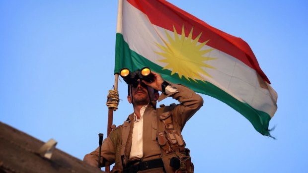 A Kurdish Peshmerga fighter holds a position on the front line in the Gwer district, 40 kilometres south of Erbil.