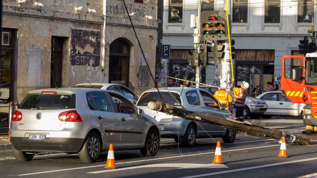 Cars were stuck under power lines near the corner of Brunswick and Johnston streets in Fitzroy. 
