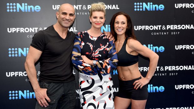<i>Australian Ninja Warrior</i> host Rebecca Maddern with contestants, husband and wife team Zac and Amanda. 
