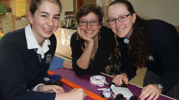 Sydney's Moriah College team, from left, Hannah Whitmont, teacher Talia Hoffman and Sarah Miller working on a solar car design, a process they applied to the NRMA challenge.